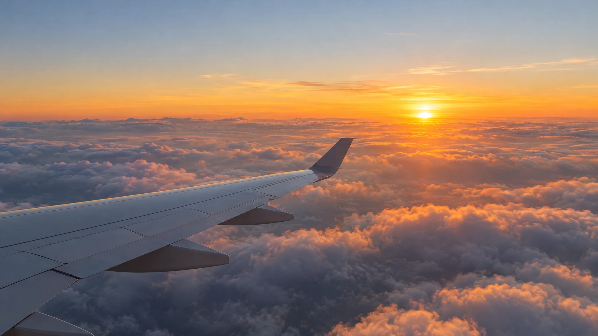 Airplane flying above the clouds